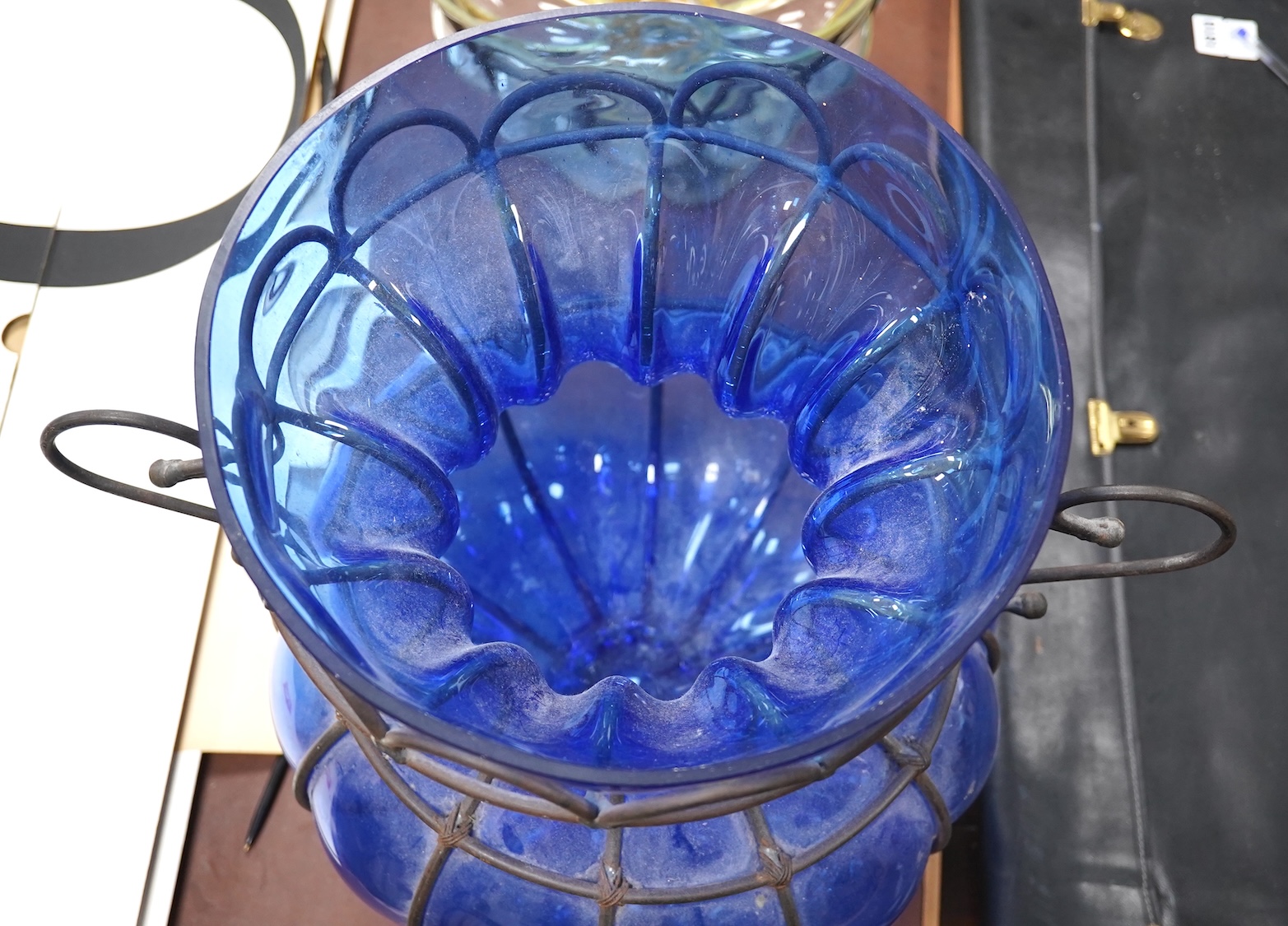 A wrought and cast iron mounted large blue glass vase, 49cm. Condition - would benefit from a clean, otherwise good